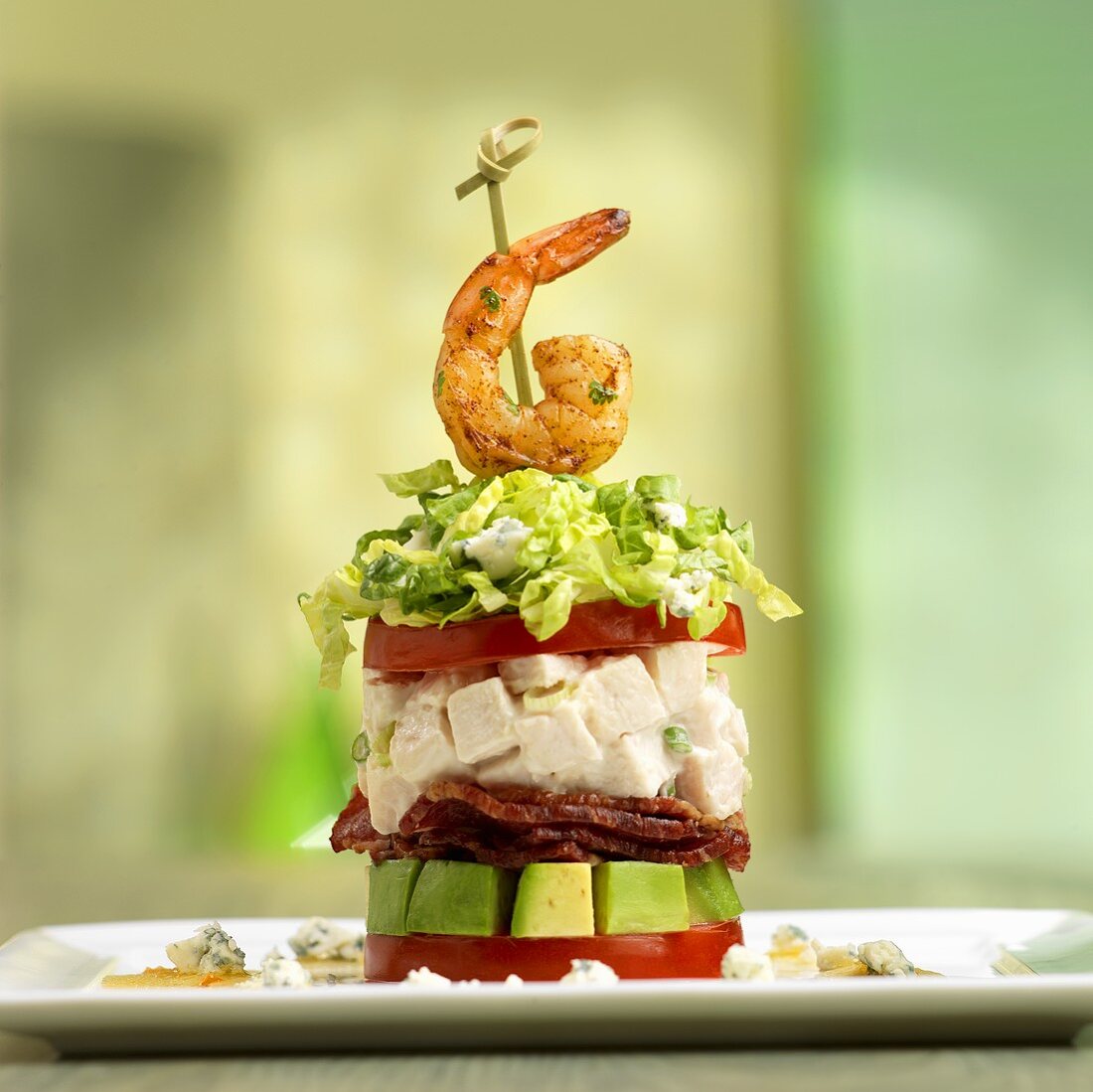 Stacked Cobb Salad Topped with Shrimp