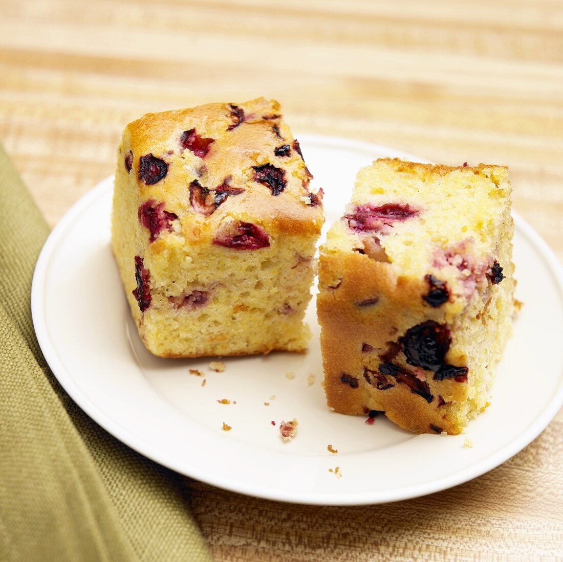 Two Pieces of Cranberry Corn Bread on White Plate