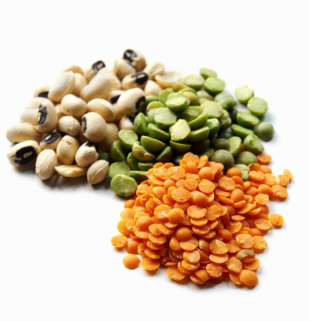 Three Piles of Assorted Lentils and Beans; White Background