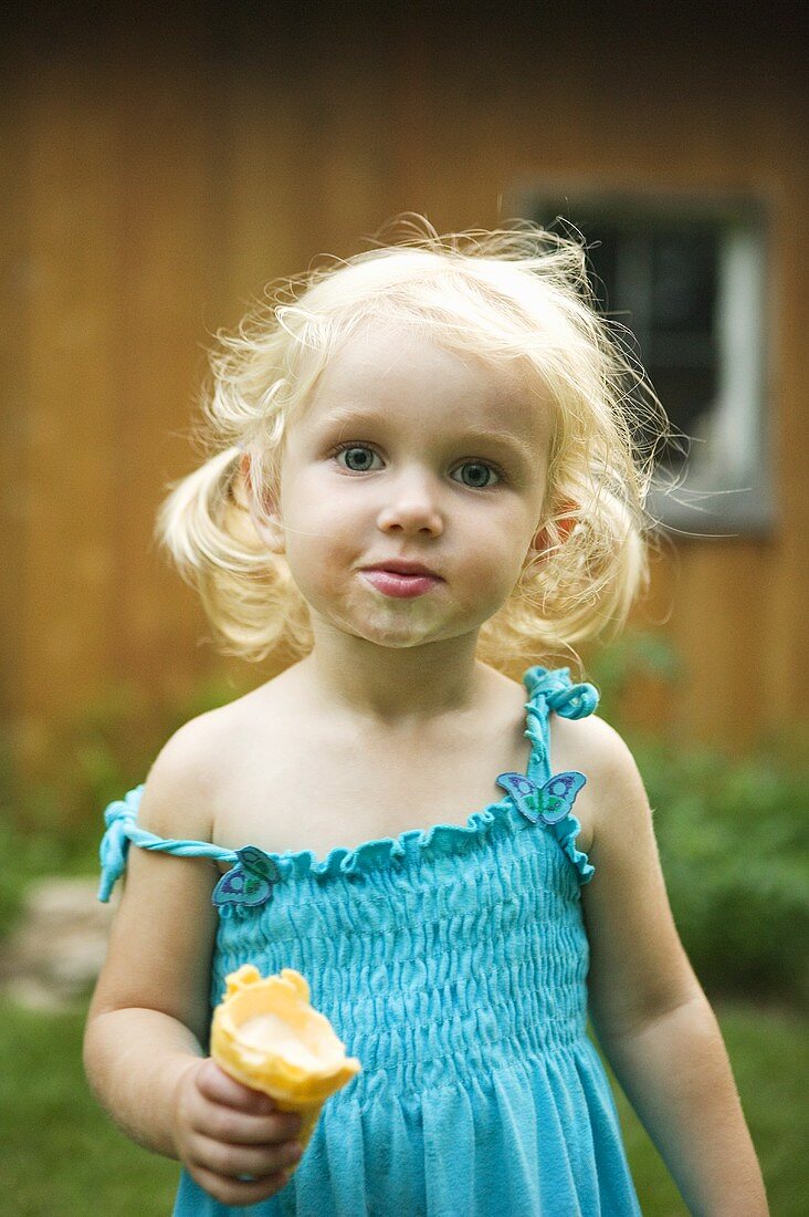 Little Girl Holding Partially Eaten Ice Cream Cone