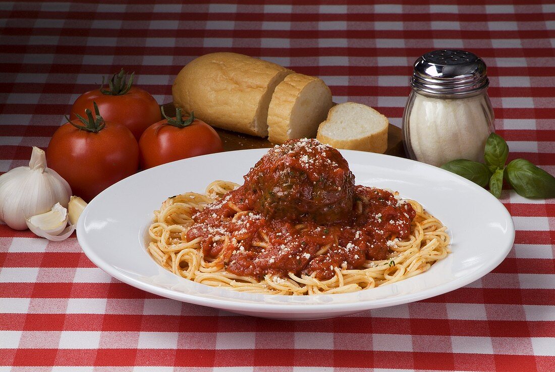 Spaghetti with One Large Meatball and Sauce; Ingredients and Bread