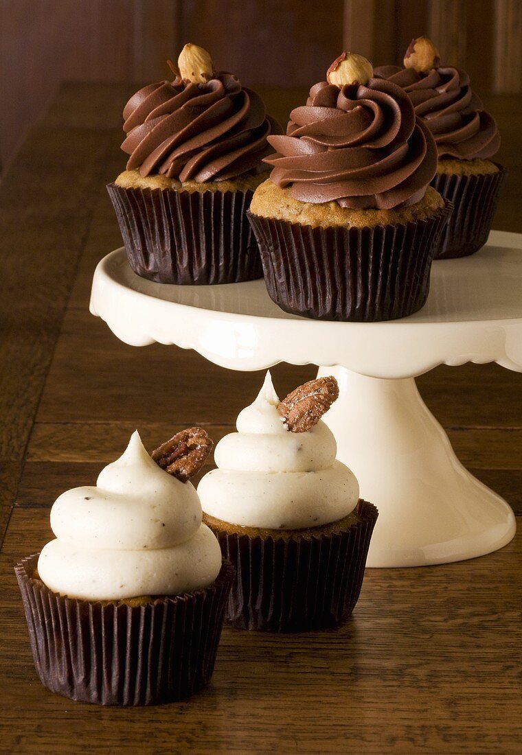 Assorted Frosted Cupcakes with Nut Garnishes