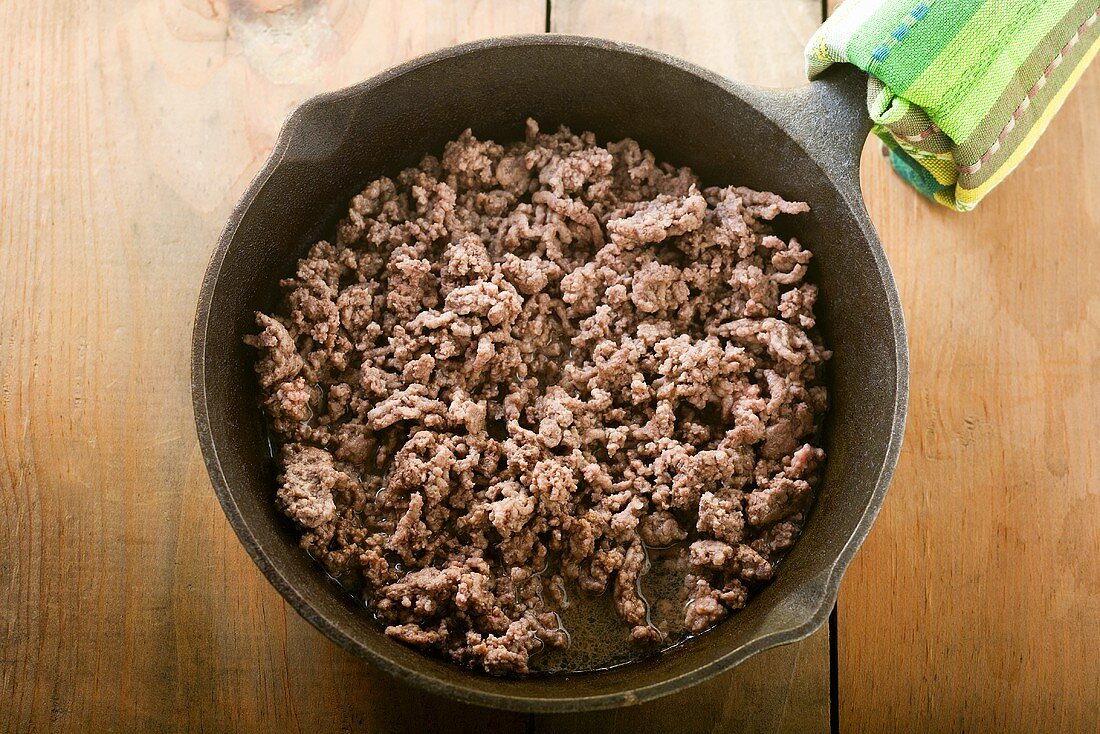 Cooked Ground Beef in a Cast Iron Skillet