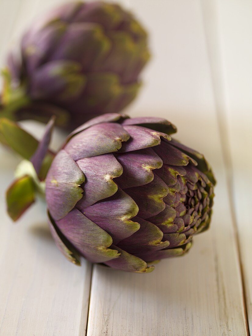 Purple Artichokes on Wooden Table