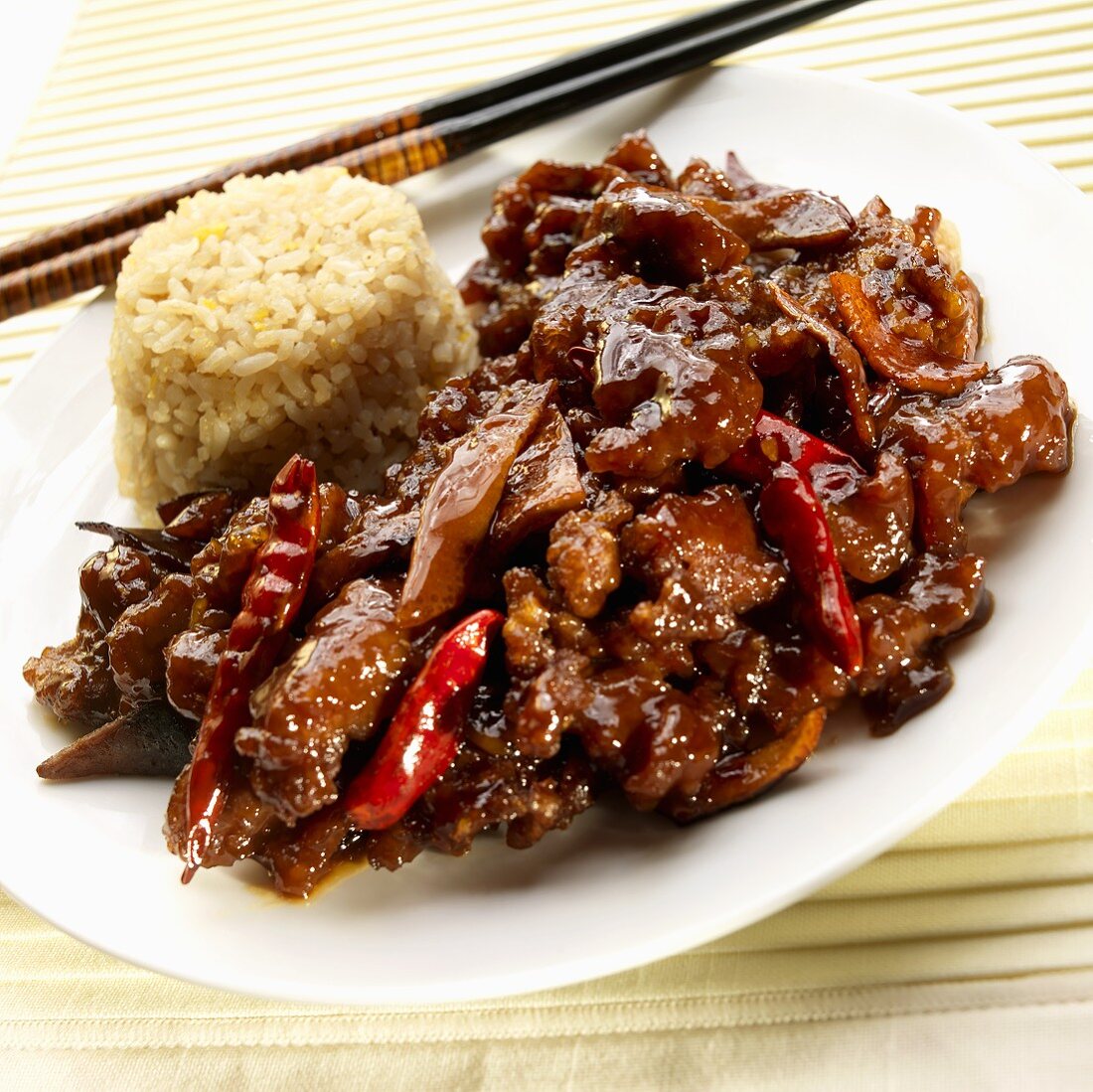 Orange Beef with Fried Rice and Chopsticks 