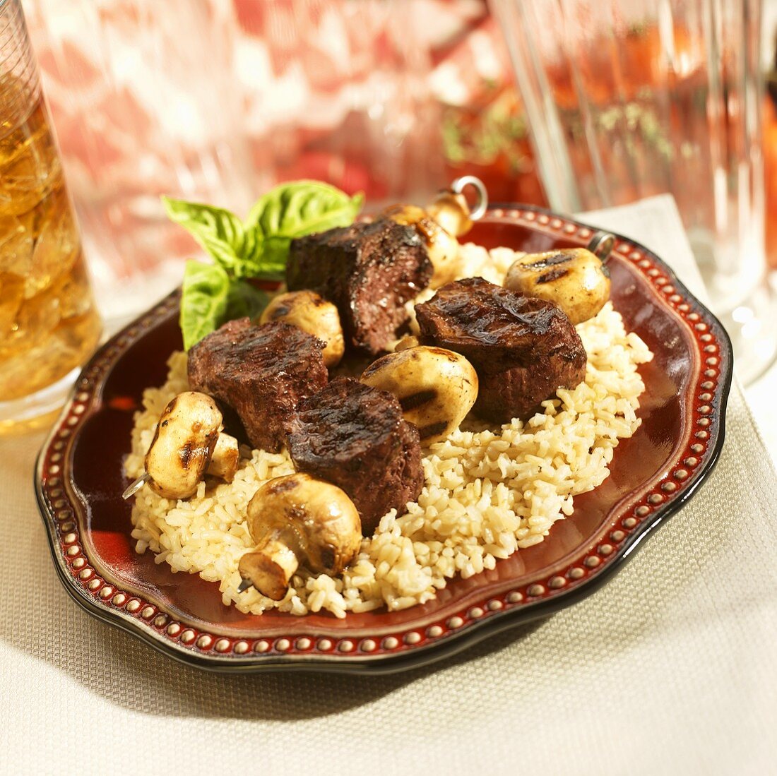 Two Steak and Mushroom Skewers on Rice 