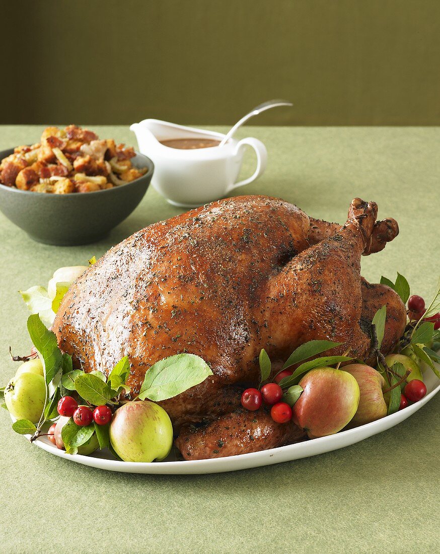 Thanksgiving Turkey on Platter with Fruit; Stuffing and Gravy