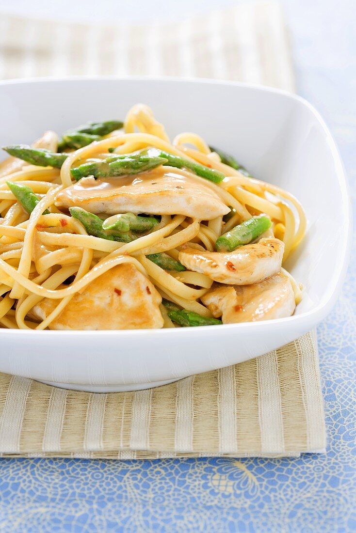 Sesame Chicken and Asparagus Over Noodles