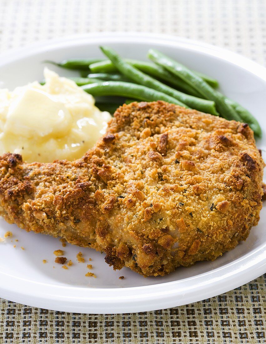 Breaded Baked Pork Chop with Mashed Potatoes and Beans