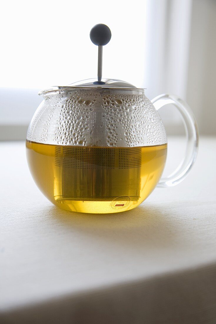 Chamomile Tea Steeping in Glass Pot
