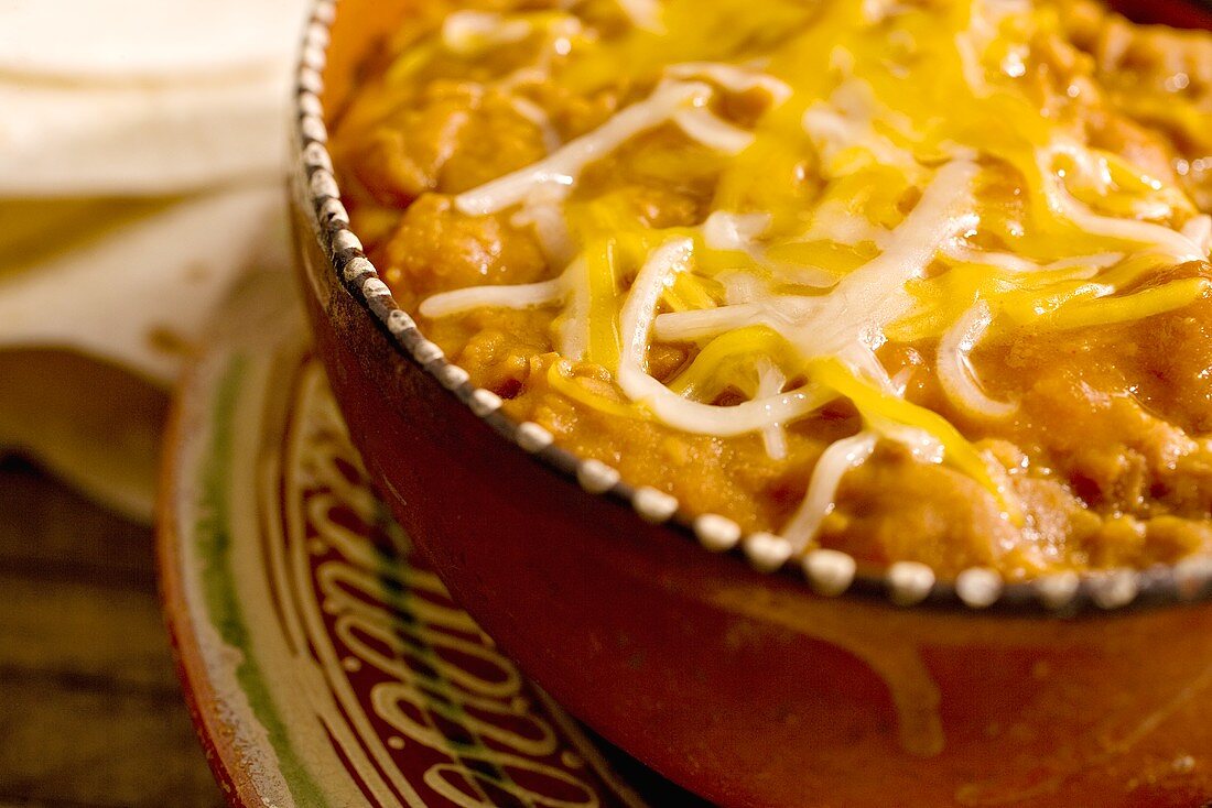 Cheese Melted on Frijoles Refritos; Refried Beans