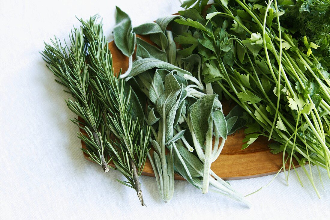 Assorted Herbs on a Wooden Board