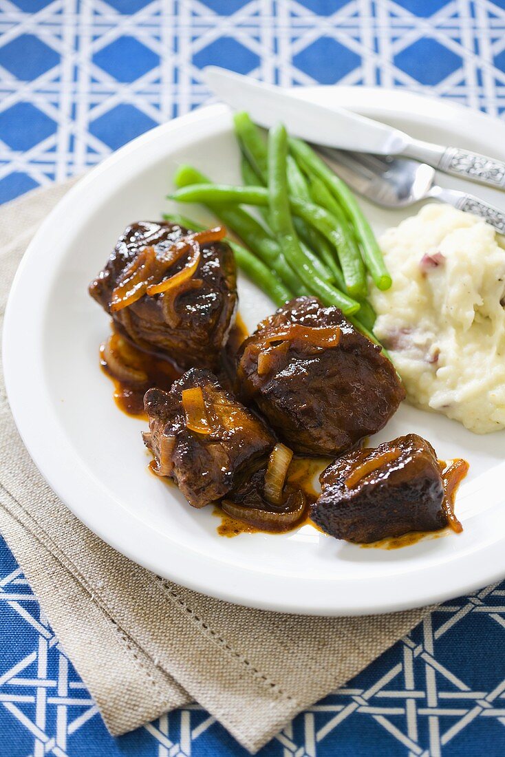 Barbecued Steak Tips with Mashed Potatoes and Beans