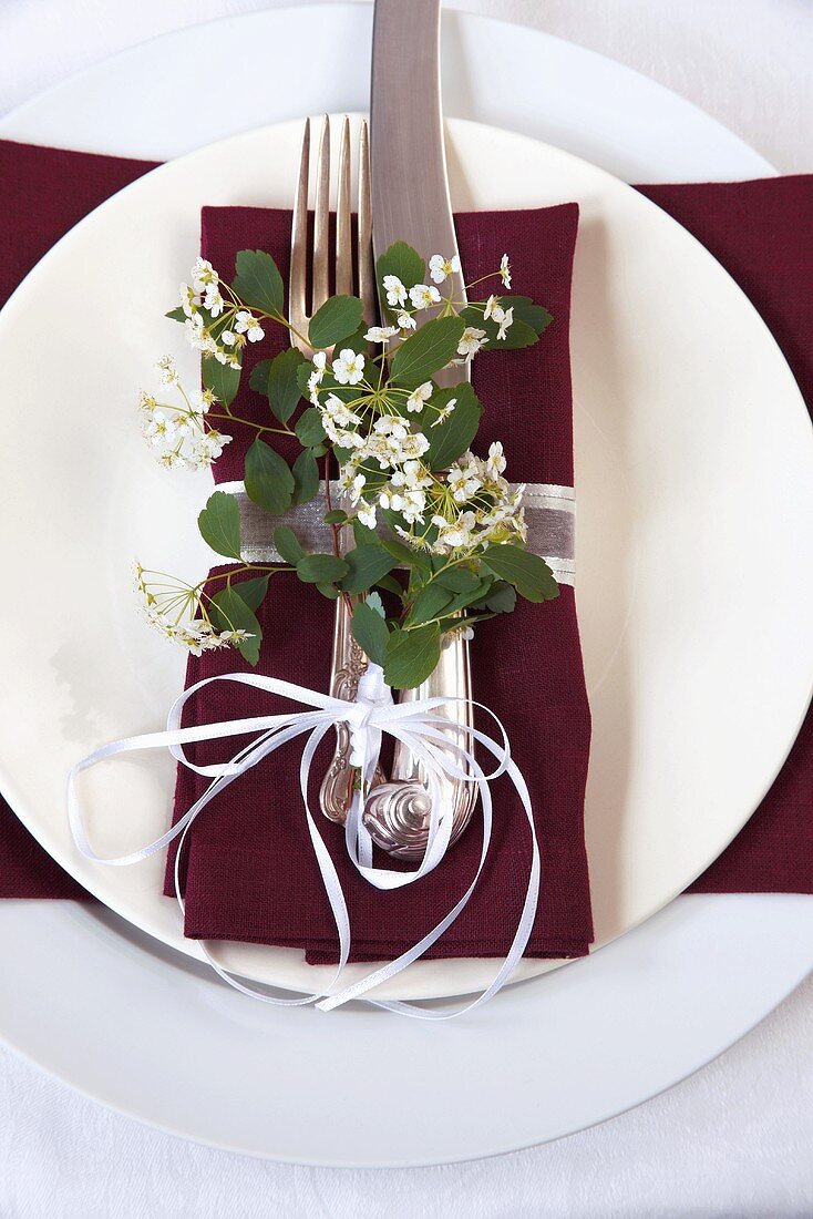 Place Setting with Maroon Napkin and Spring Flowers