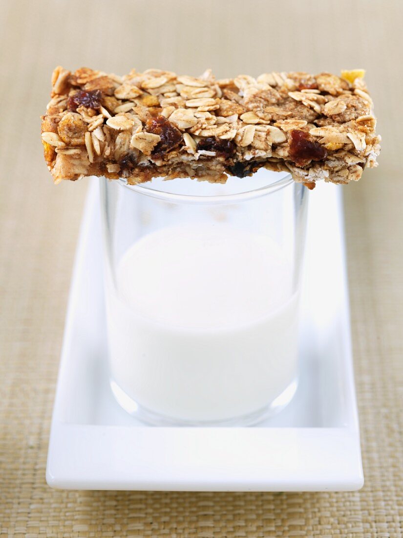 Homemade Granola Bar on Glass of Milk