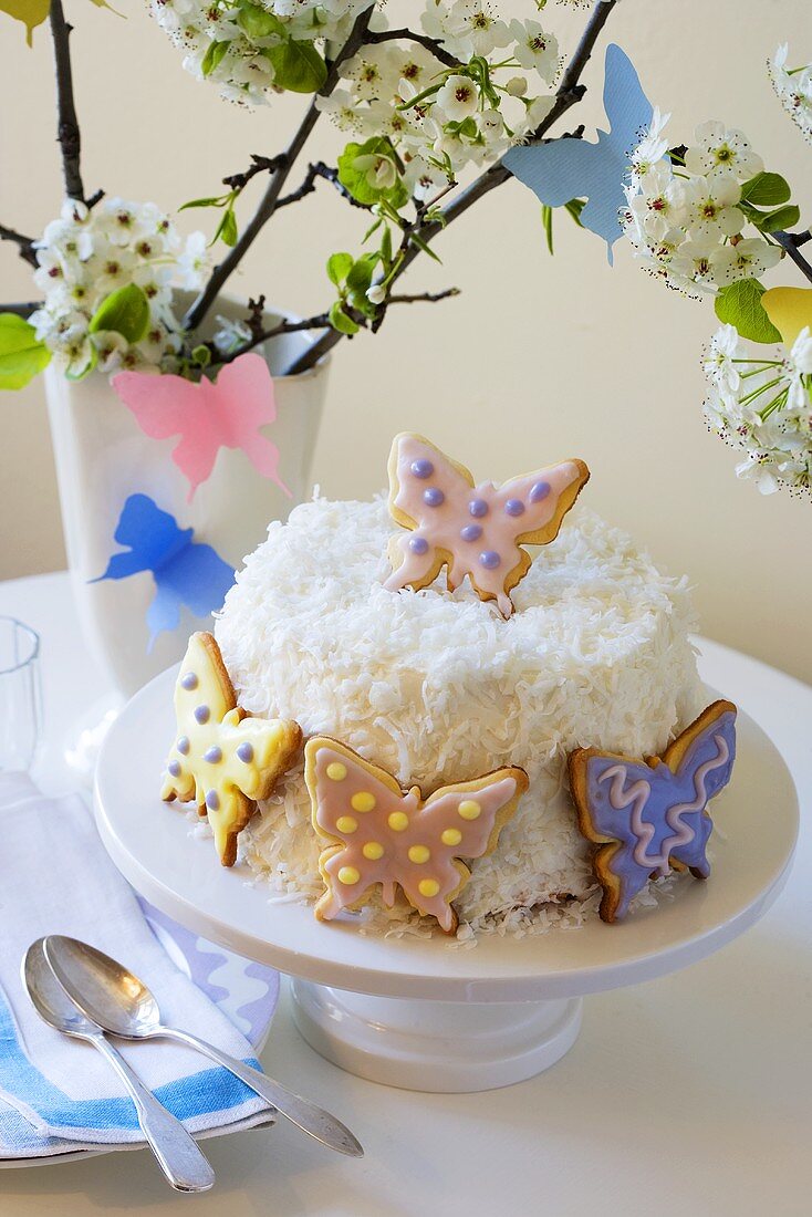 Coconut Cake Decorated with Butterfly Cookies