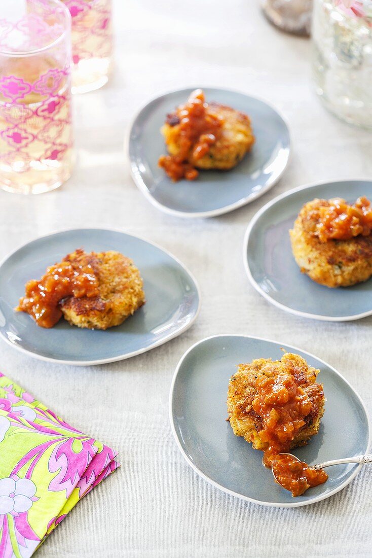 Mini Crab Cakes with Sauce on Individual Dishes