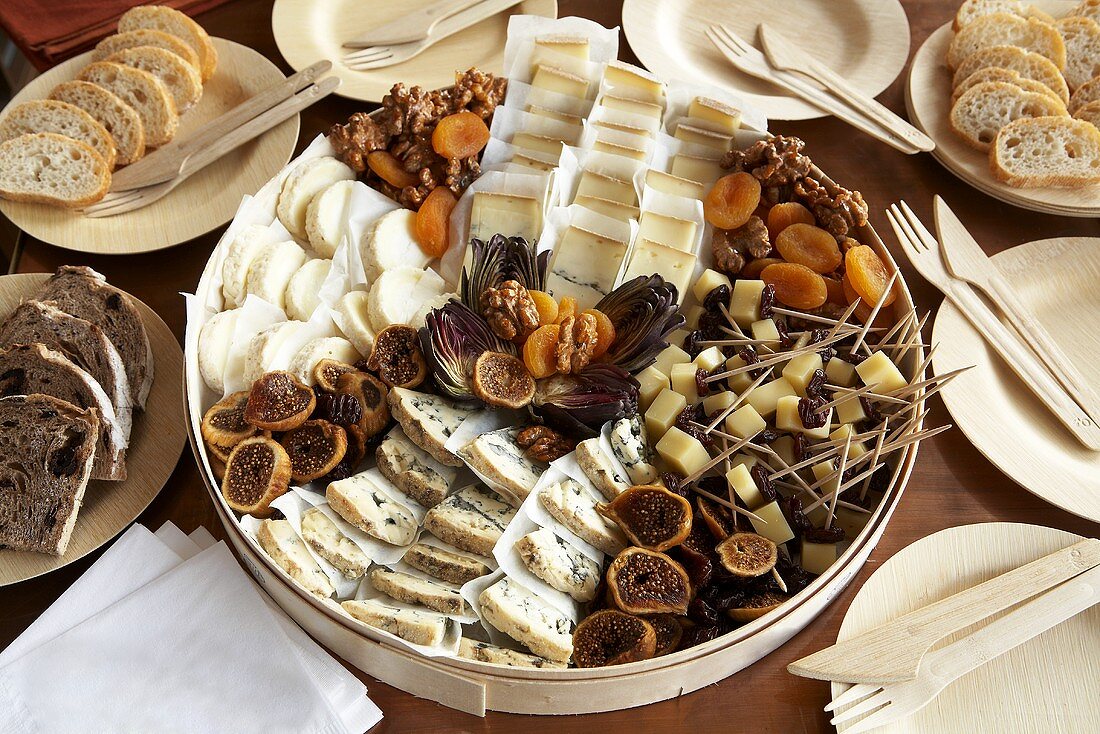 Assortment of Cheese, Dried Fruit and Nuts with Various Bread Slices