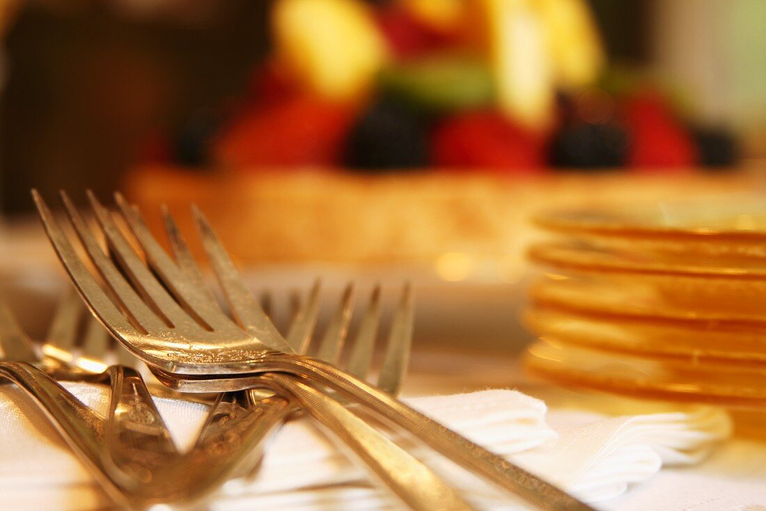 Filigreed Dessert Forks and Stacked Dessert Plates