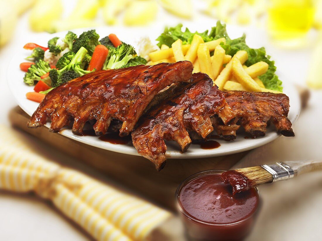 Barbecue Ribs with Fries and Vegetables; Barbecue Sauce
