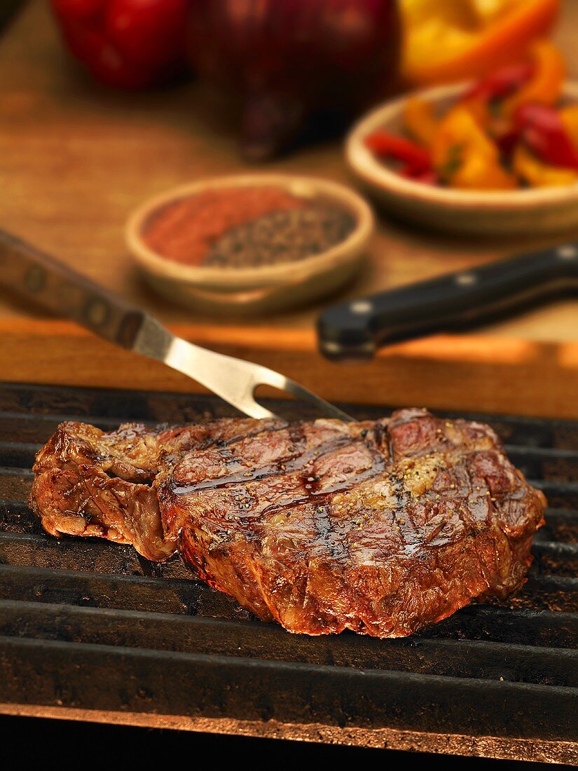 Steak on the Grill with Carving Fork