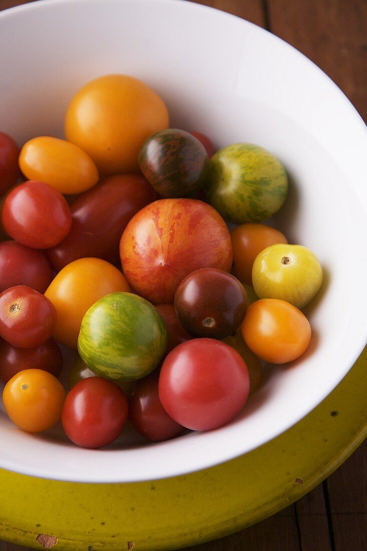 Various Heirloom Tomatoes in a White Bowl