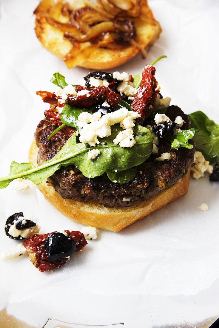 Greek Lamb Burger with Feta Cheese, Sun Dried Tomatoes and Olives
