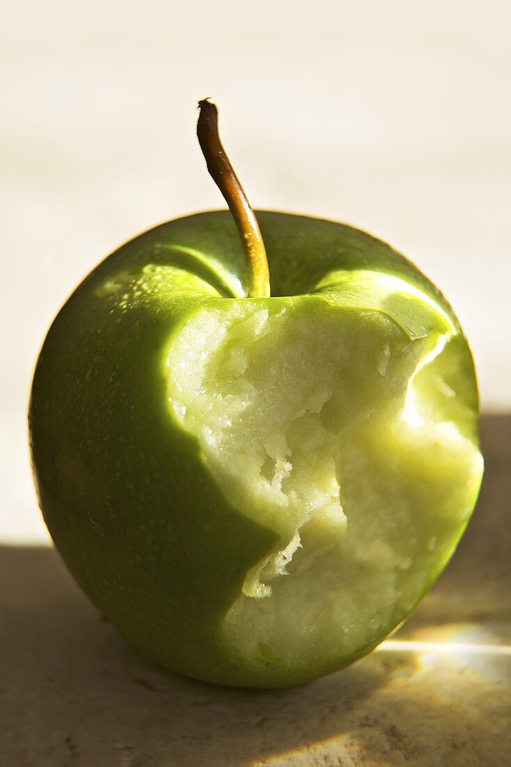 Partially Eaten Organic Green Apple