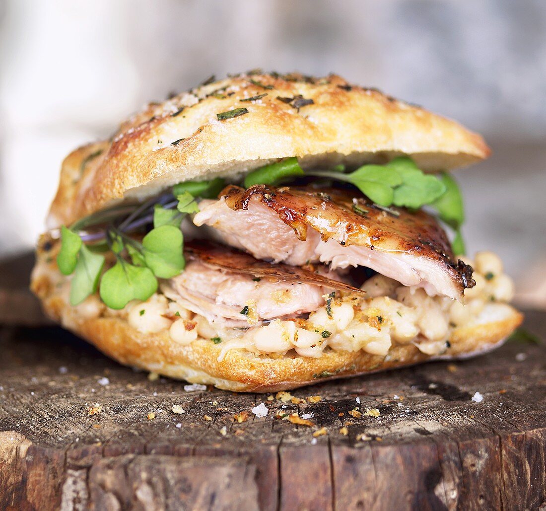 Roasted Pork Sandwich with White Beans and Greens on Bun