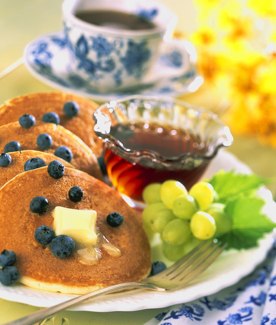 Pancakes with Fresh Blueberries, Maple Syrup and Grapes; Coffee