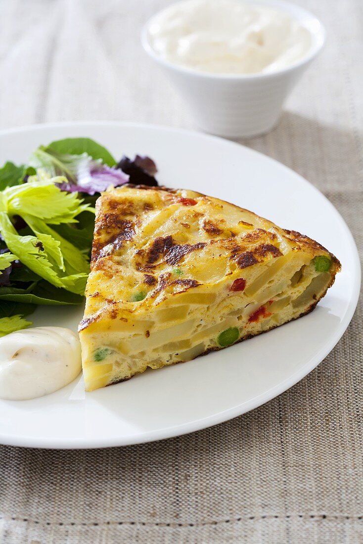 Potato tortilla with salad leaves