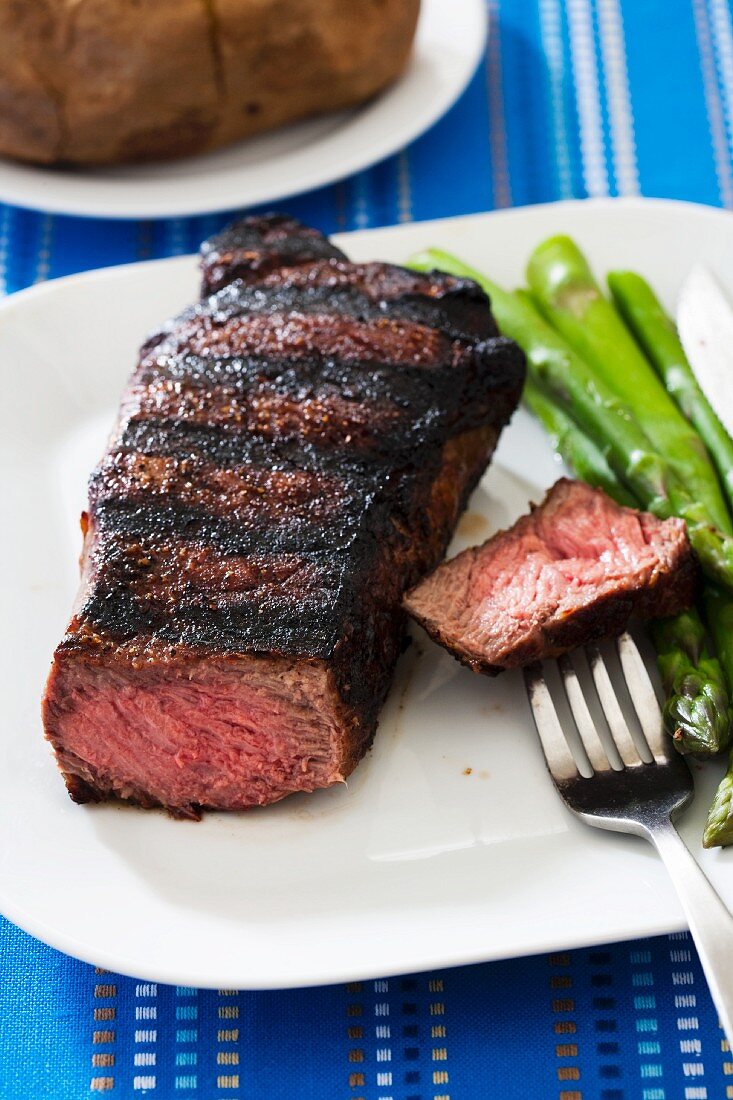 Grilled New York strip steak (medium rare) with asparagus