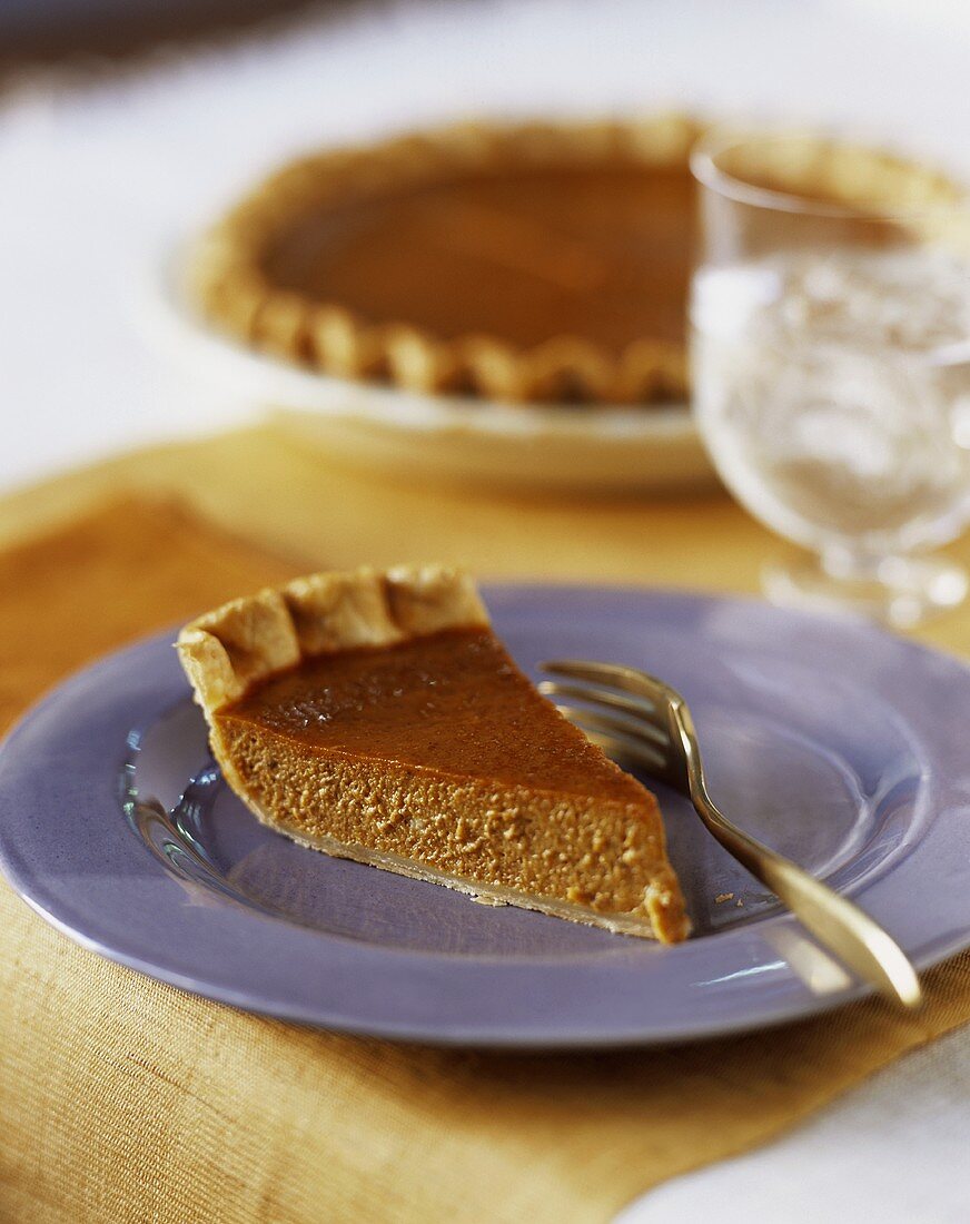 Slice of Pumpkin Pie on Blue Plate