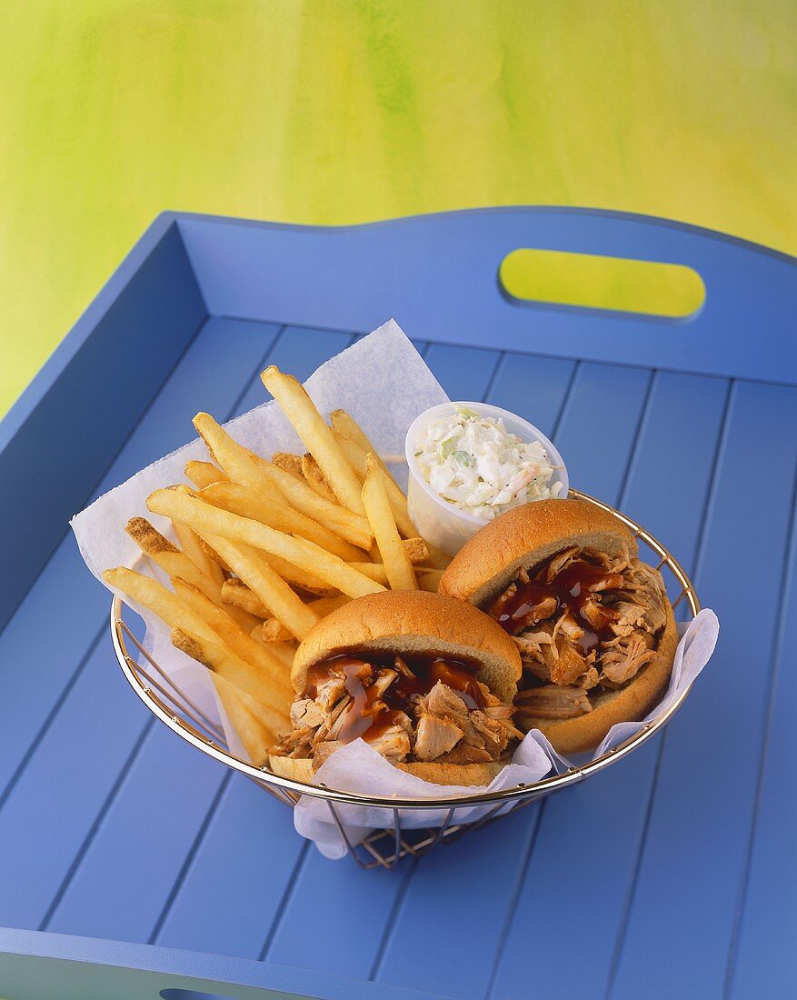 Barbecue Pulled Pork Sandwiches with French Fries in Wire Basket