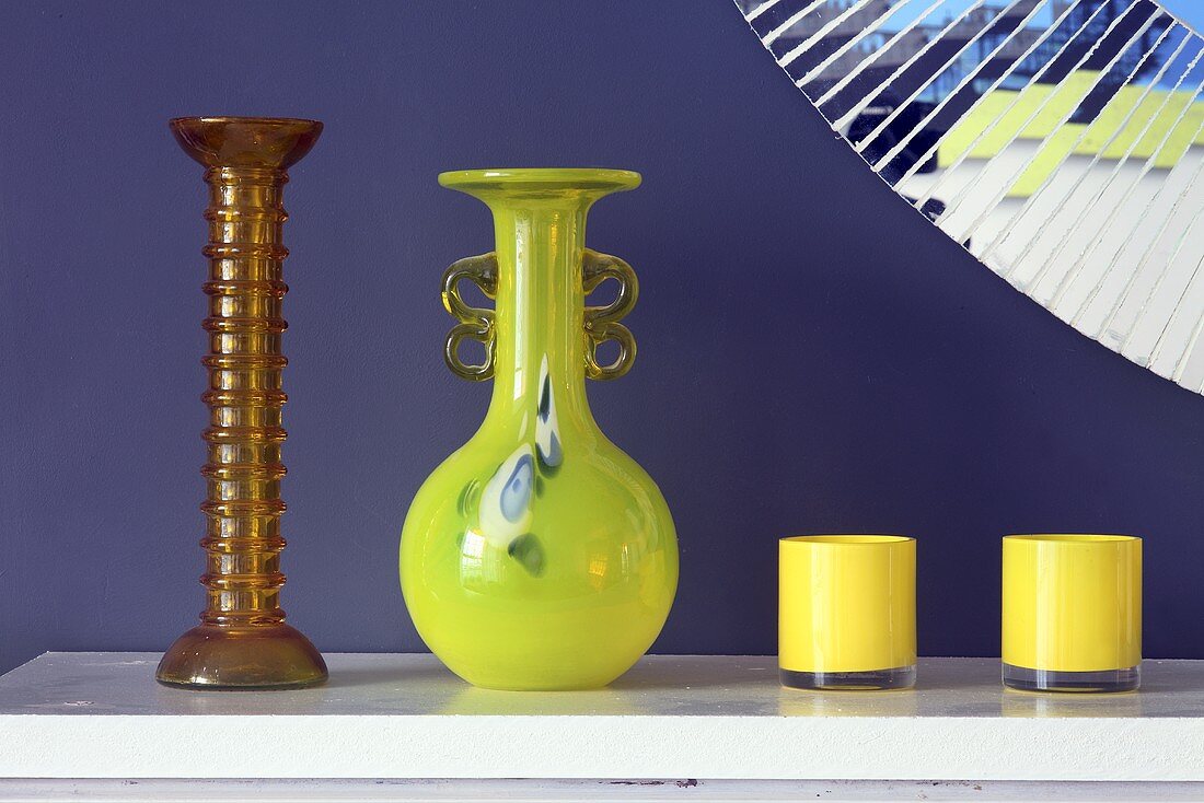 Glass vases on a white shelf