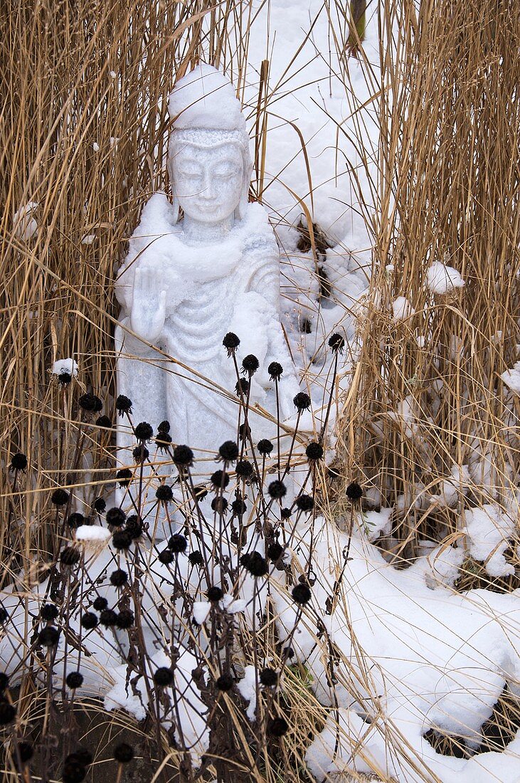 An oriental sculpture in the snow