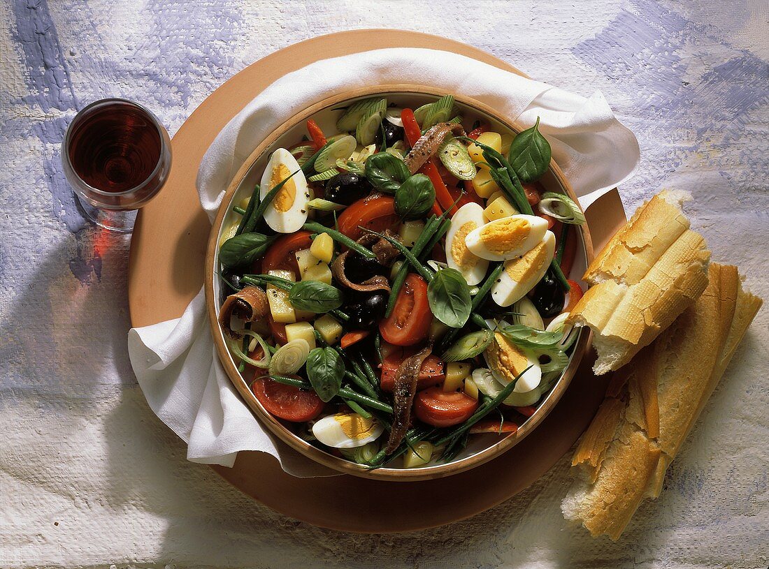 Colorful Salade Nicoise with French Bread; Wine