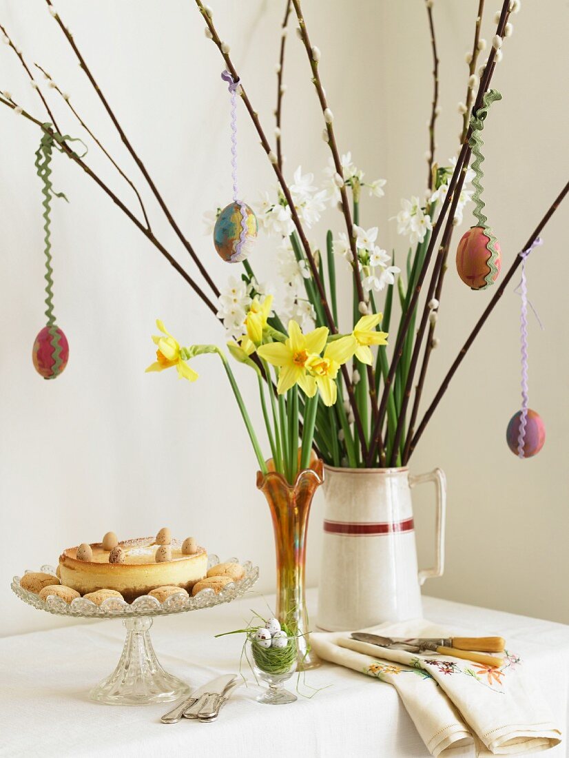 An Easter bouquet and a cake on a cake plate