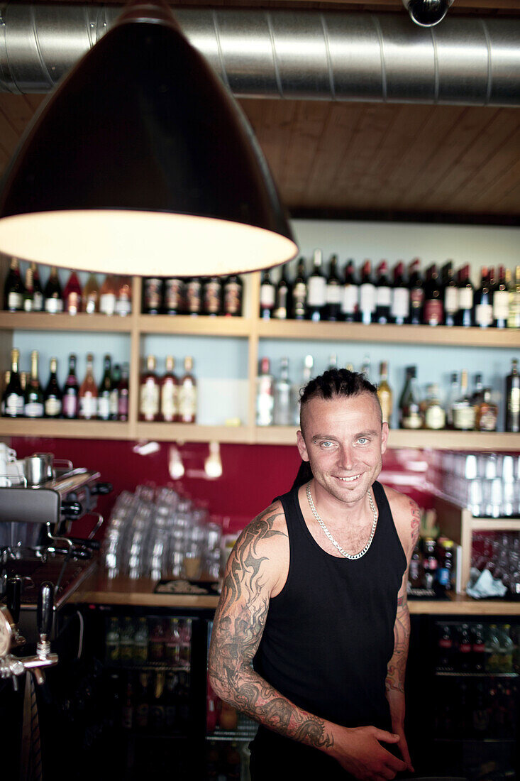 Barkeeper Varis in hip Cabo Cafe, cafe and restaurant at lake Kisezers, Mezaparks, Riga, Latvia