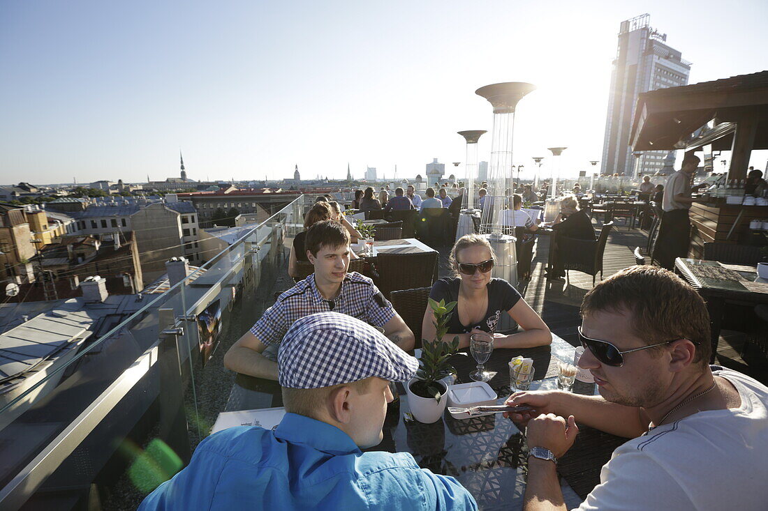 Rooftop terrace of the restaurant 8th Floor, on top of shopping mall Galleria Riga, view over the old town, Riga, Latvia