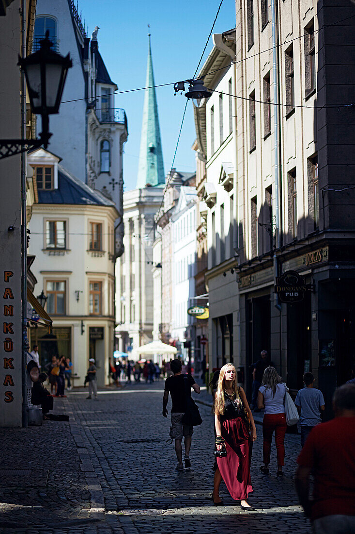 Tourists at the weekend in Skunu Iela, cathedral square in the back, old town centre, Riga, Latvia