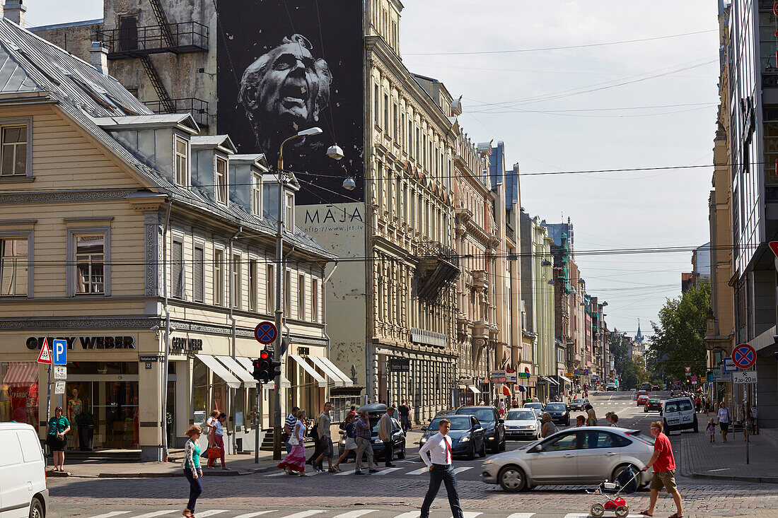 Pedestrian crossing Lacplesa Iela and Terbatas Iela, mural of a theatre, hip shopping area, centre, Riga, Latvia