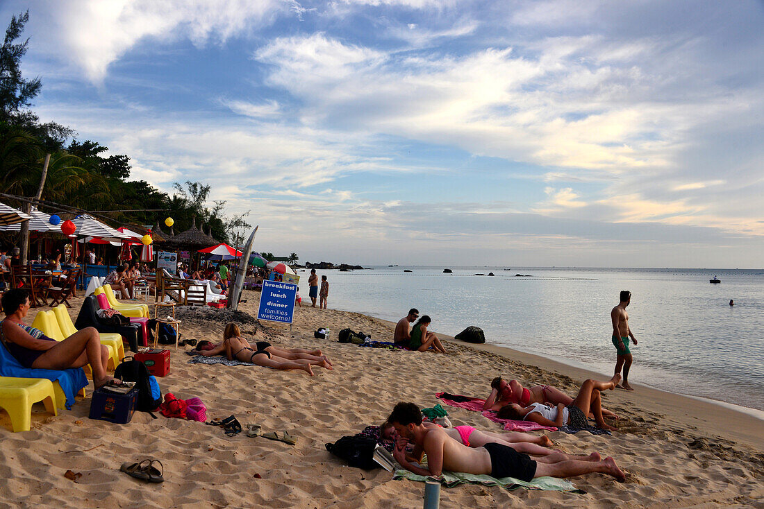 Sunbathing on the beach at Longbeach on the island of Phu Quoc, Vietnam, Asia