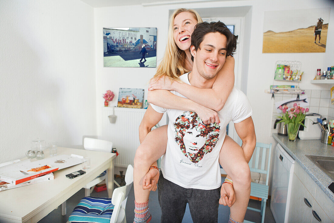Man giving his girlfriend a piggyback ride, Fun