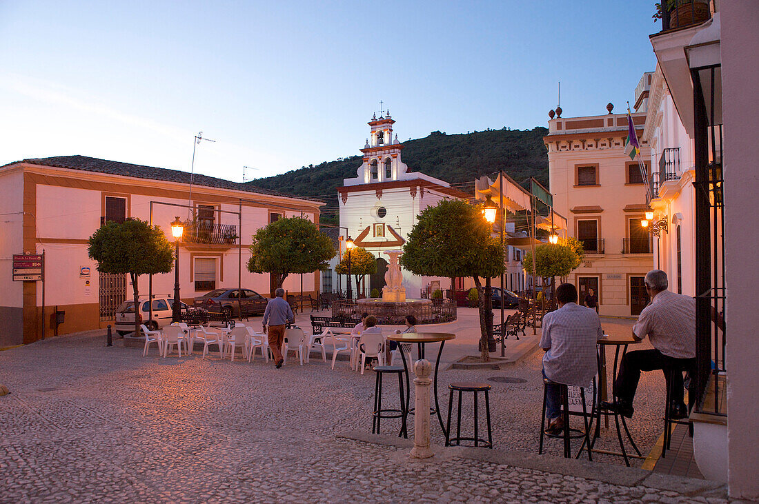 Evening mood with bar tables on the square at Almonaster la Real, Sierra de Aracena, Huelva, Andalusia, Spain