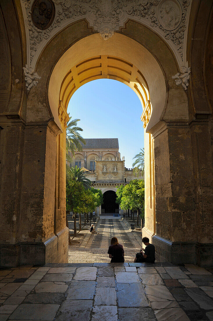 Moorish gate and garden at the Mezquita in the evening, Cordoba, Andalusia, Spain