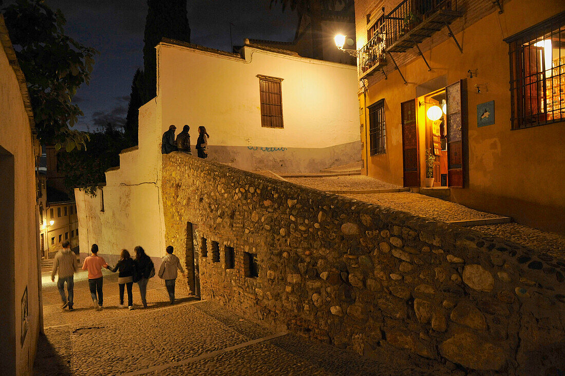Night in the alleys of the Albaicin, alley down to the center, Granada, Andalusia, Spain