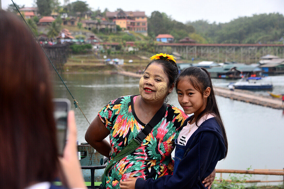 Shan women at the Wooden bridge of Sangkhlaburi at Khao Laem reservoir, center-Thailand, Thailand