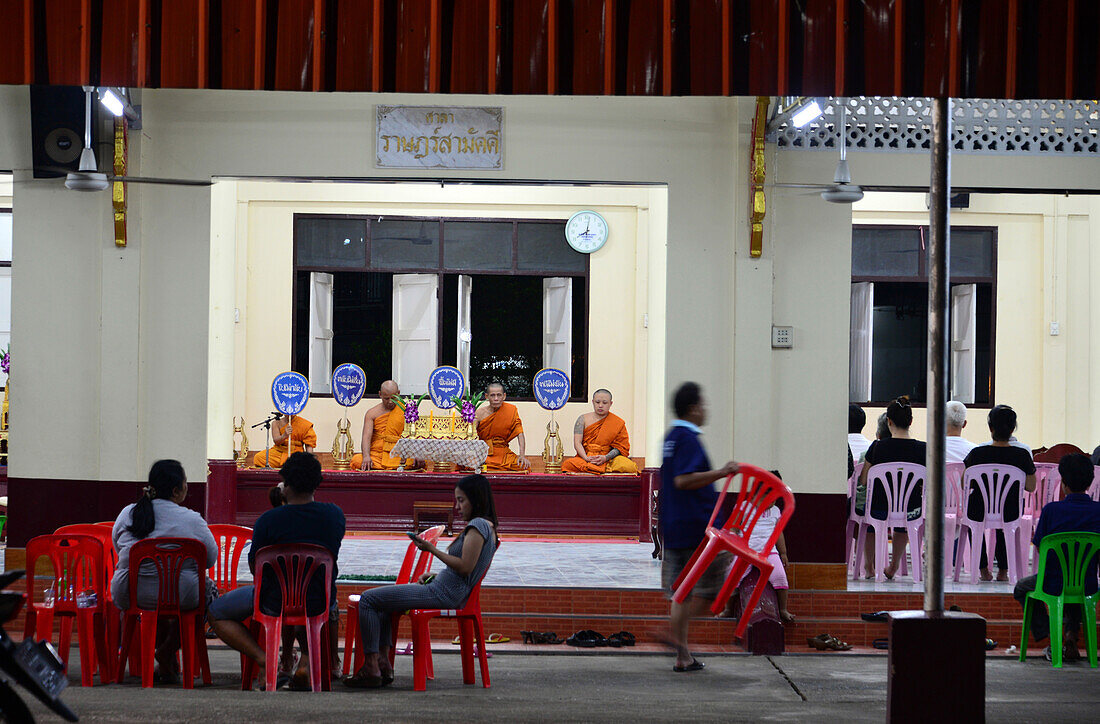 Monks at evening prayer in Chantaburi, Golf of Thailand, Thailand