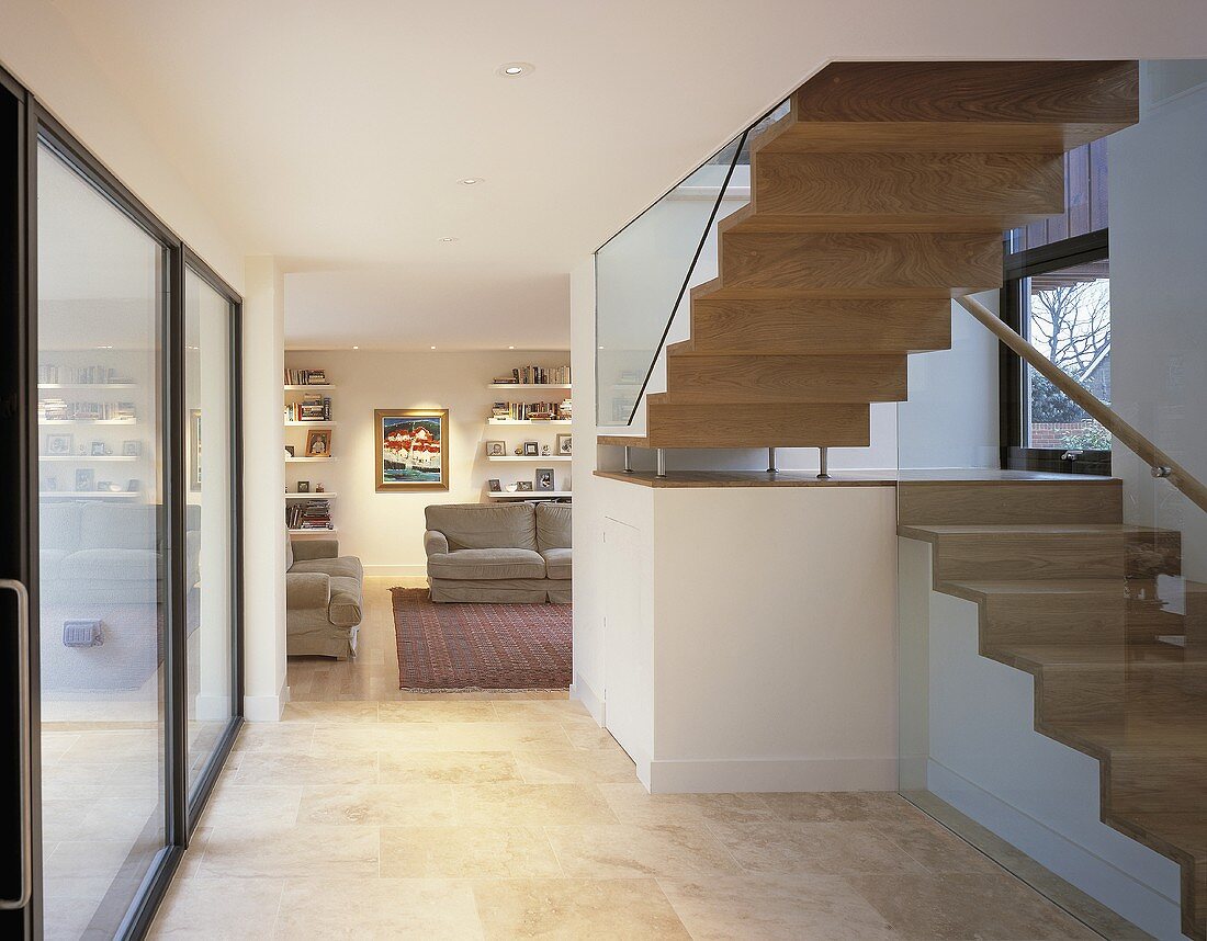 An open stairway with a view into an open-plan living room